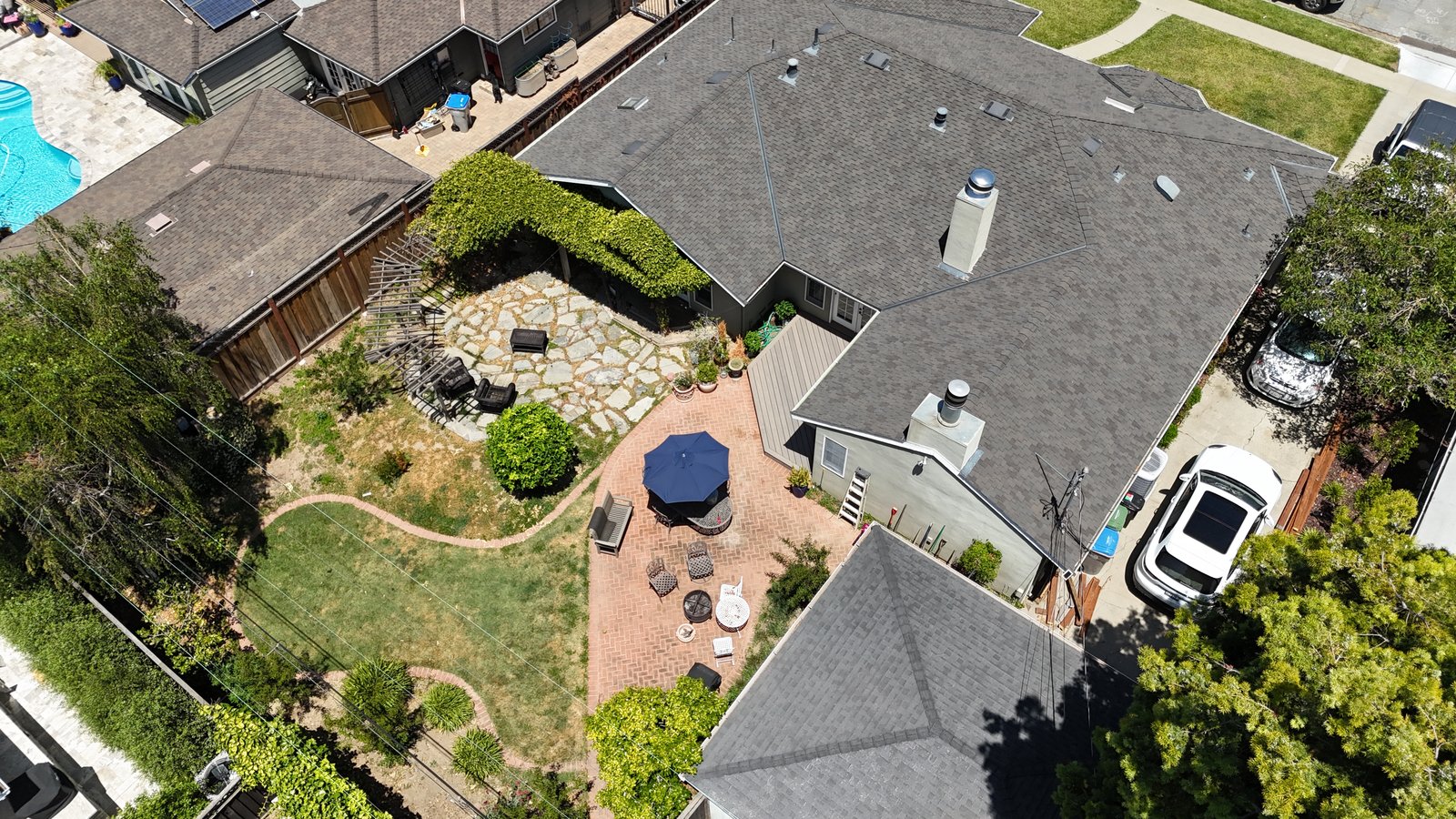 Aerial shot of a property backyard and pool for a listing